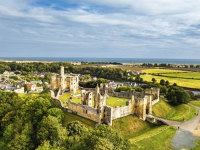 Warkworth Castle over River Coquet from a drone, Warkworth, Northumberland, England, United Kingdom