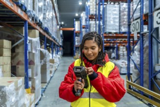 Woman worker managing inventory and scanning products with a handheld scanner in a cold storage