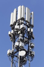 5 G cell phone tower against blue sky, Düsseldorf, North Rhine-Westphalia, Germany