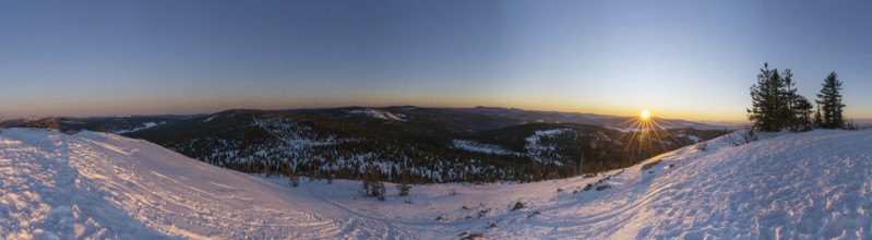 View from Mount Lusen over the hills of the bavarian forest at sunrise in winter, Bavaria, Germany