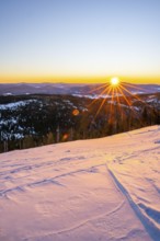 Sunrise over the hills of czech republic from Mount Lusen wth the view over the hills of the