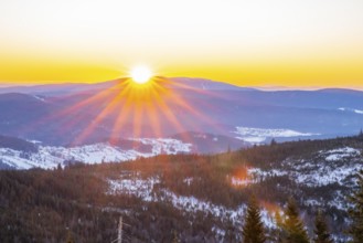 Sunrise over the hills of czech republic from Mount Lusen wth the view over the hills of the