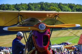 Maintenance work on a vintage aircraft at the Rossfeld Luftsportverein 2012 on Rossfeld in
