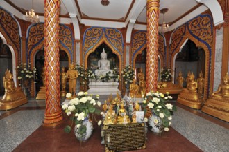 Worship room prayer room with altar Buddha statues of Buddha in temple complex Wat Chalong