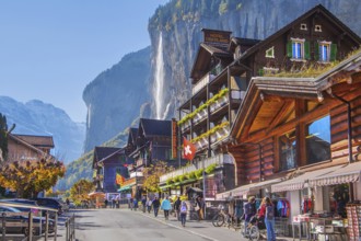 Village road with Staubbach waterfall, Lauterbrunnen, Bernese Oberland, Canton of Bern, Switzerland