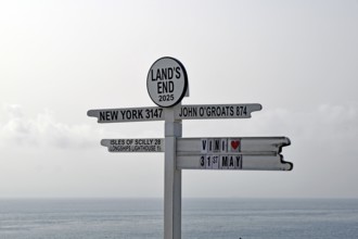 Guide to a coastal town with various city names and distances, New York, Land's End, Cornwall,