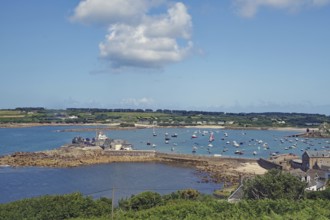 Harbour landscape with boats on water and coast in the background, Isles of Scilly, Cornwall, Great