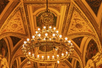 Sumptuous room and chandelier in the Vienna State Opera, Vienna, Austria