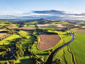 Fields and Farms over River Teviot and Minto Crags from a drone, Roxburghshire, Scottish Borders,