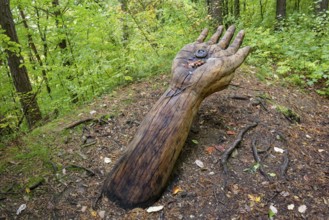 Wooden sculpture The Remmselesstein, Pfullinger Sagenweg, stories and legends, by woodsaw artist