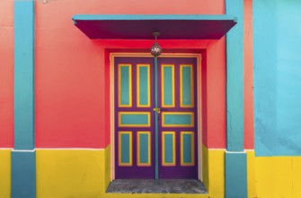 Colorful colonial architecture of historic center of Flores, Guatemala