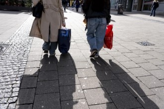 Shadows of passers-by shopping in the city center, Essen, North Rhine-Westphalia