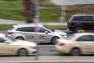 Uber rental car, drives past taxis, Düsseldorf-Bilk train station, taxi stand, competition, North
