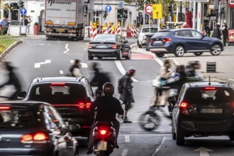 Pedestrians at Düsseldorf-Bilk train station, cross Friedrichstraße at a pedestrian crossing with