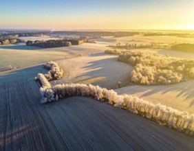 Bird Eye Perspective of Frost Covered Farmland. Seasonal Agricultural Scenery, winter and autumn