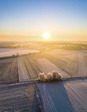 Bird Eye Perspective of Frost Covered Farmland. Seasonal Agricultural Scenery, winter and autumn