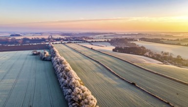 Bird Eye Perspective of Frost Covered Farmland. Seasonal Agricultural Scenery, winter and autumn