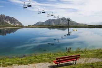 Mountain landscape with reservoir and chairlift, Saloberkopf, Warth, Bregenzerwald, Vorarlberg,