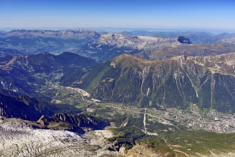 View from the Aiguille du Midi mountain station observation deck into the valley with the city,