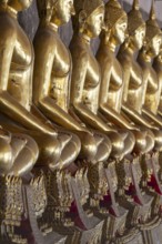 Gilded Buddha statues (Bhumispara mudra: Buddha Gautama at the moment of enlightenment), Wat Suthat