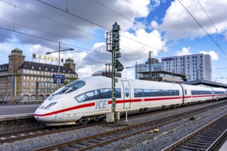 ICE train on track 2 in Essen main station, view of the city center, Handelshof building with Essen