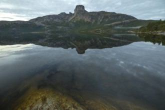 Morning dream over the quiet Steigtindvatnet near Bodø. The mountain is reflected in the lake