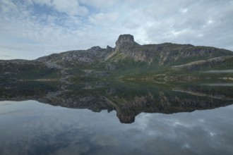 Reflection in Steigtindvatnet in front of the majestic Steigtinden in Norway near Bodø
