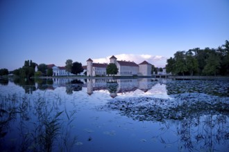 Rheinsberg Castle, lakeside with Lake Grienerick at night, prime example of Friederician Rococo,