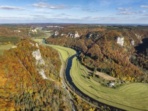 Aerial view of Upper Danube Valley surrounded by autumn vegetation, on the horizon Werenwag Castle,