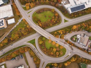 Modern road network with roundabout and autumn trees from an aerial perspective, Dornstetten,