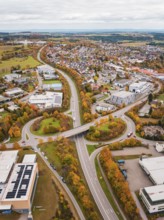 Urban area with roads and buildings in autumn colors seen from a bird's eye view, Dornstetten,