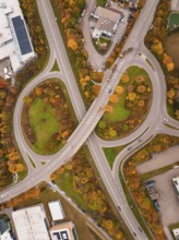 Complex road structure with roundabout and autumn colors, seen from a bird's eye view, Dornstetten,