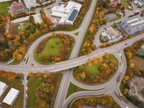Complex road network with autumn trees and modern infrastructure viewed from above, Dornstetten,
