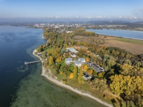 Aerial view of the Mettnau peninsula, surrounded by autumn vegetation, in western Lake Constance