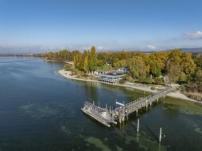 Aerial view of the Mettnau peninsula, surrounded by autumn vegetation, in western Lake Constance
