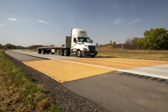 Blue Earth, Minnesota - A 'Golden Stripe' of yellow pavement marks the spot where Interstate 90 was