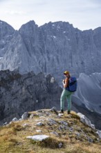 Female hiker on hiking trail, hiking to Gamsjoch, behind Dreizinkenspitze and Laliederer Wand,