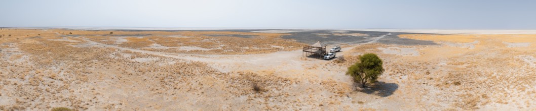 Panorama, off-road cars on a salt pan, dry landscape, Botswana