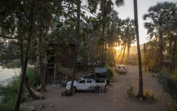 Overland car at a campsite at Epupa Falls, Namibia