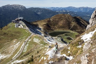 Female hiker on hiking trail below the Kanzelwand, back left Kanzelwandbahn mountain station,