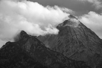 The cloudy summit of the Sonntaghorn, highest peak in the Chiemgau Alps, seen from Falkenstein near