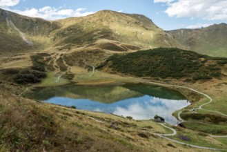 Schlappoldkopf and Söllerkopf are reflected in Schlappoldsee, Fellhorn, Oberstdorf, Oberallgäu,