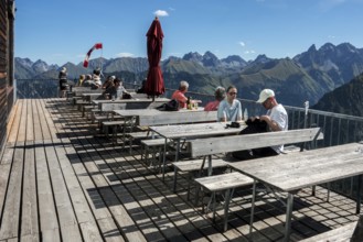 Terrace of the restaurant Gipfelstation Fellhornbahn, behind mountains of the Allgäu Alps,