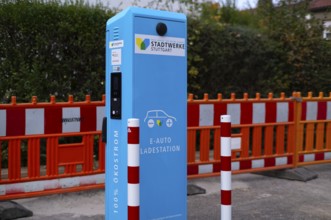 Parking lot with gas pump, EnBW charging station for electric cars, charging station, e-mobility,