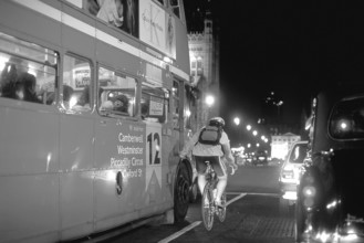 London at night, bus and cyclist on Westminster Bridge, black and white, London, England, Great