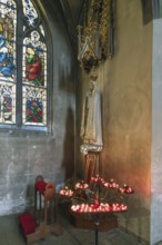 Sacrificial candles with Saint Mary, St. Martin Church, Amberg, Upper Palatinate, Bavaria, Germany