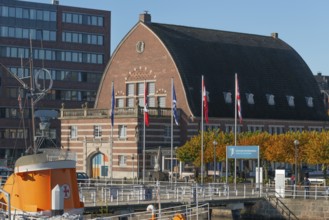 Kiel port, fishing hall shipping museum, architecture, barrel roof, brick building, flags, museum