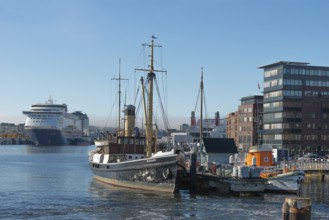 Kiel port, Seegarten museum bridge with historic tonneau buzzard from 1906 and sea rescue cruiser
