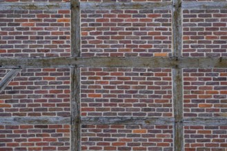 Brick wall and wooden beams on a half-timbered house, Legden, Münsterland, North Rhine-Westphalia,
