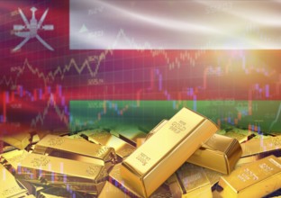 Gold bars on Oman flag in background. Gold bars stacked on Omani flag. Concept of Oman gold